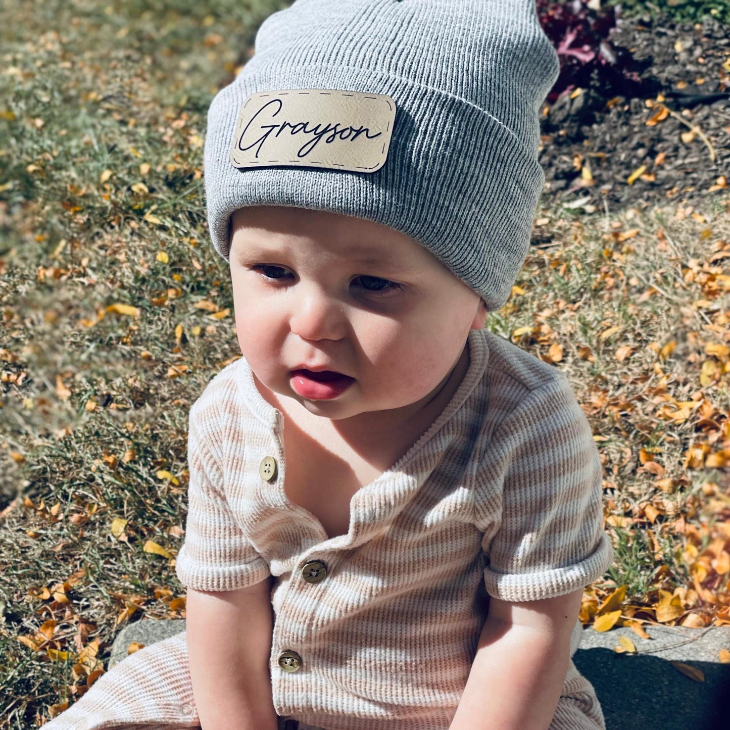 Gray infant/ baby beanie with light brown leatherette.